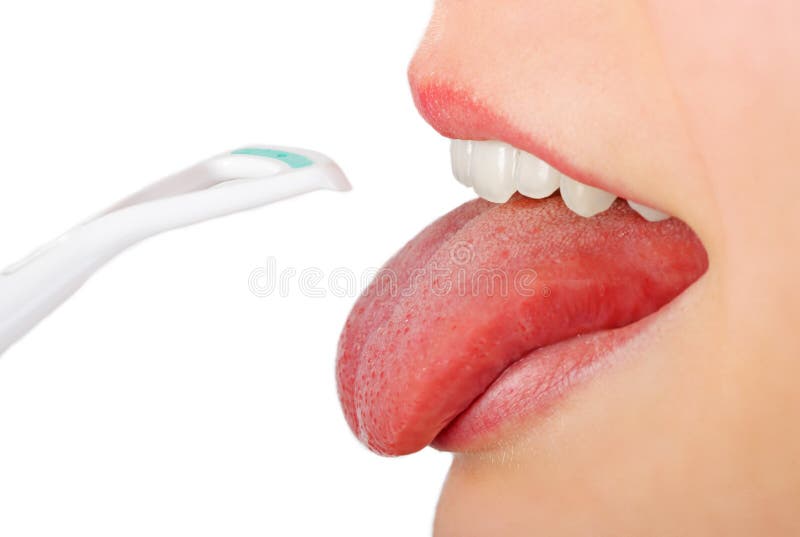 Open mouth and tongue cleaner - mouth hygiene (isolated on white). Open mouth and tongue cleaner - mouth hygiene (isolated on white)