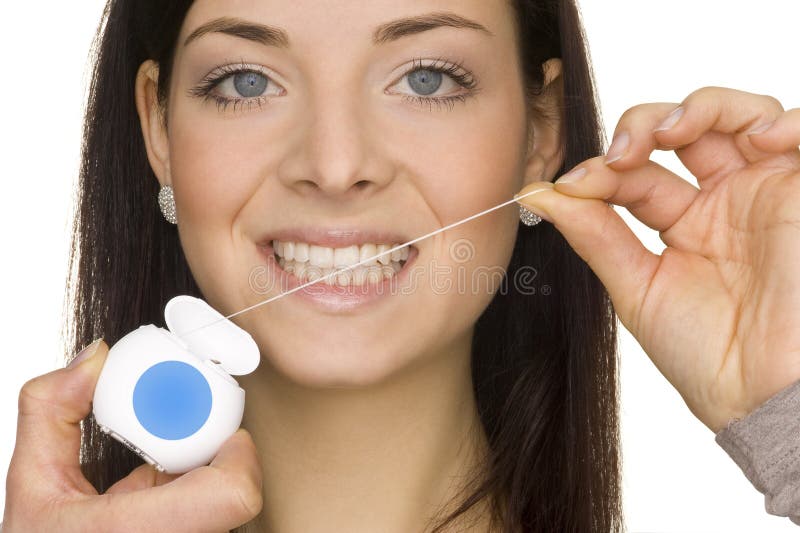 Beautiful young woman doing oral hygiene. Beautiful young woman doing oral hygiene
