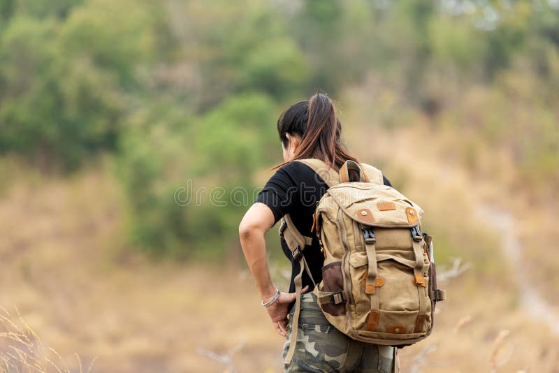 Hiker asian woman backpack walking trail activity camping outdoors for destination leisure. stock photography Hiker asian woman backpack walking trail activity camping outdoors for destination leisure. stock photography