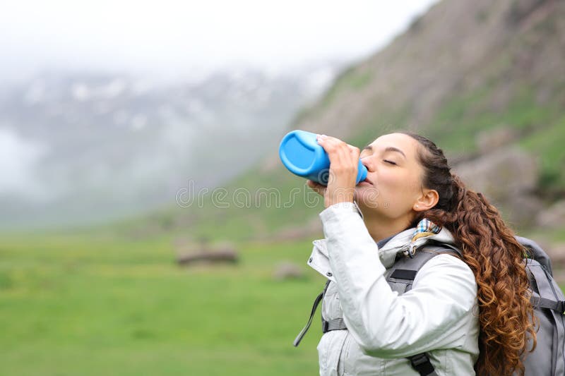 Hiker Drinking Water from Canteen in Nature Stock Photo Image of