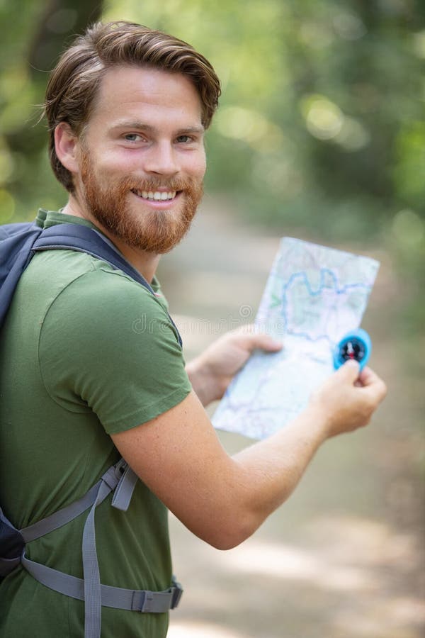 Hiker in Forest with Compass and Map Stock Image Image of equipment