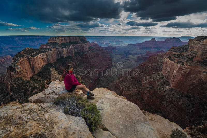 Hiker looking down Cape Royal Overlook Grand Canyon North Rim Wotans Throne