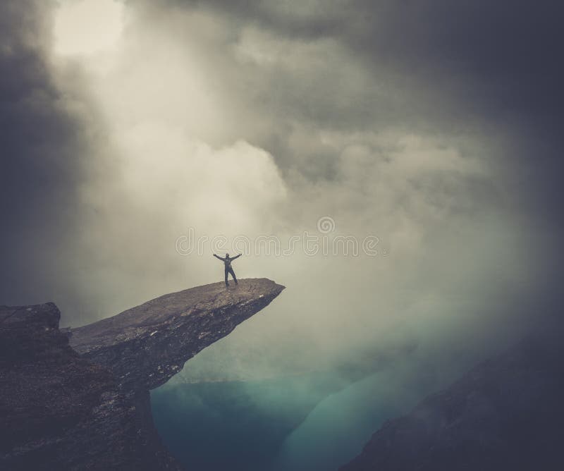 Hiker on Trolltunga with arms wide open