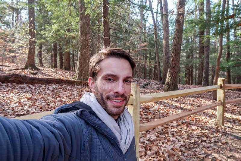 A hiker wearing winter clothes smiles stock photography A hiker wearing winter clothes smiles stock photography