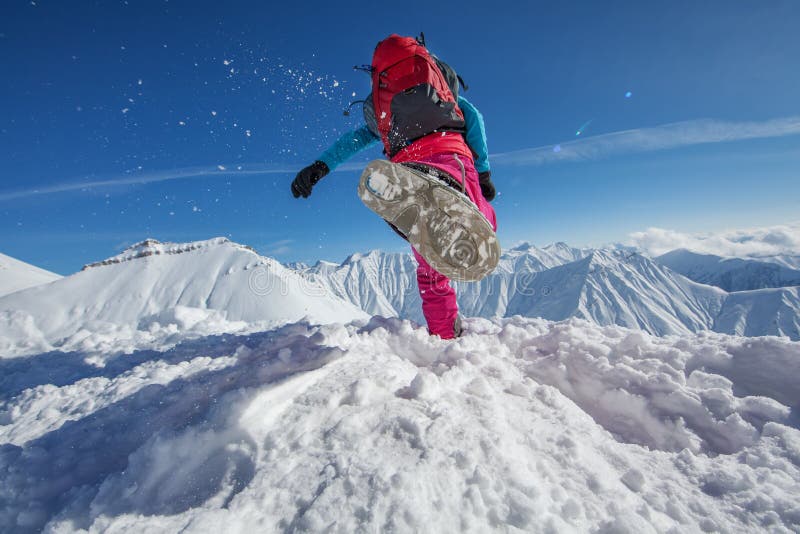 Hiker in winter mountains royalty free stock photography