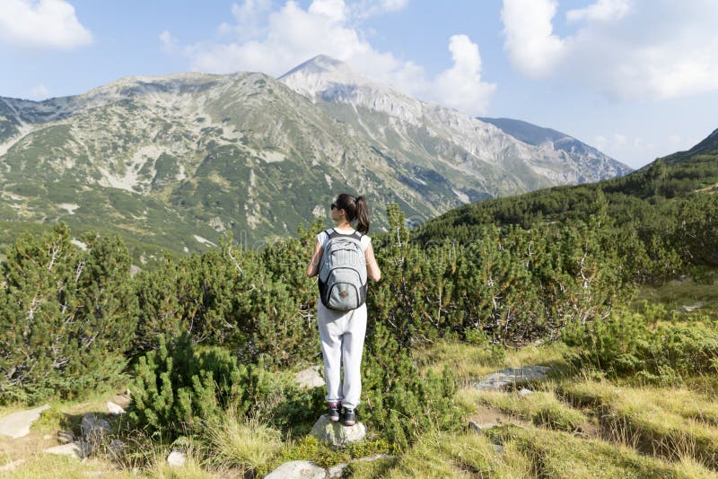 Hiker woman in a high mountain ,looking the panorama stock photography Hiker woman in a high mountain ,looking the panorama stock photography