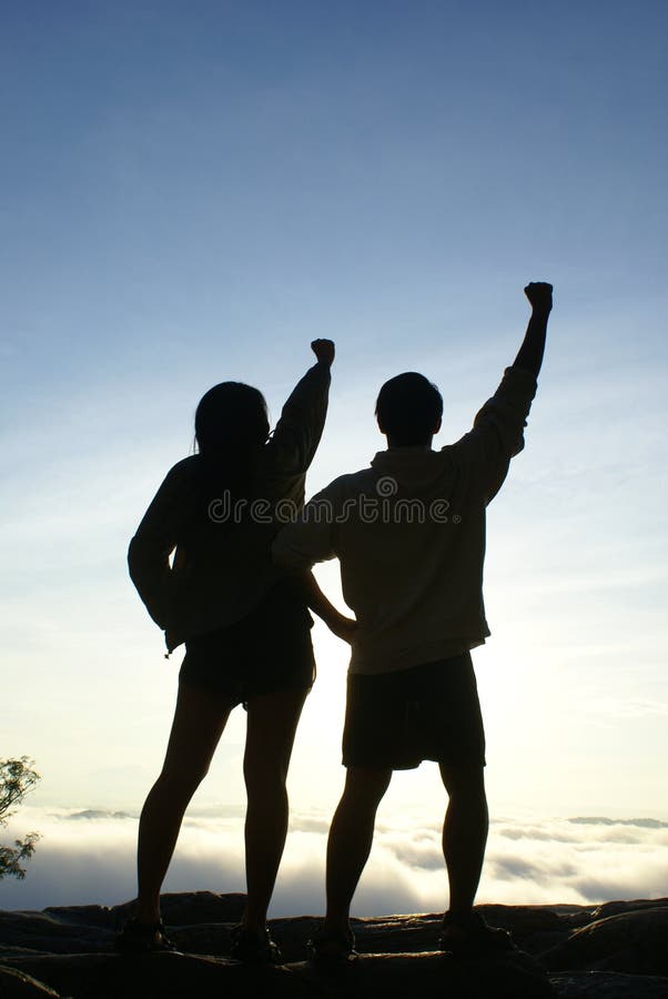 Hikers reach mountain top royalty free stock photography Hikers reach mountain top royalty free stock photography