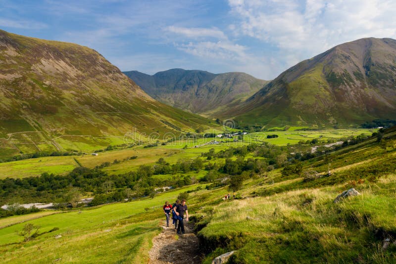 SCAFELL PIKE, ENGLAND - AUGUST 11:- Hikers beginning the climb to the summit of Scafell Pike in England`s Lake District.  Scafell Pike is England`s tallest mountain. SCAFELL PIKE, ENGLAND - AUGUST 11:- Hikers beginning the climb to the summit of Scafell Pike in England`s Lake District.  Scafell Pike is England`s tallest mountain