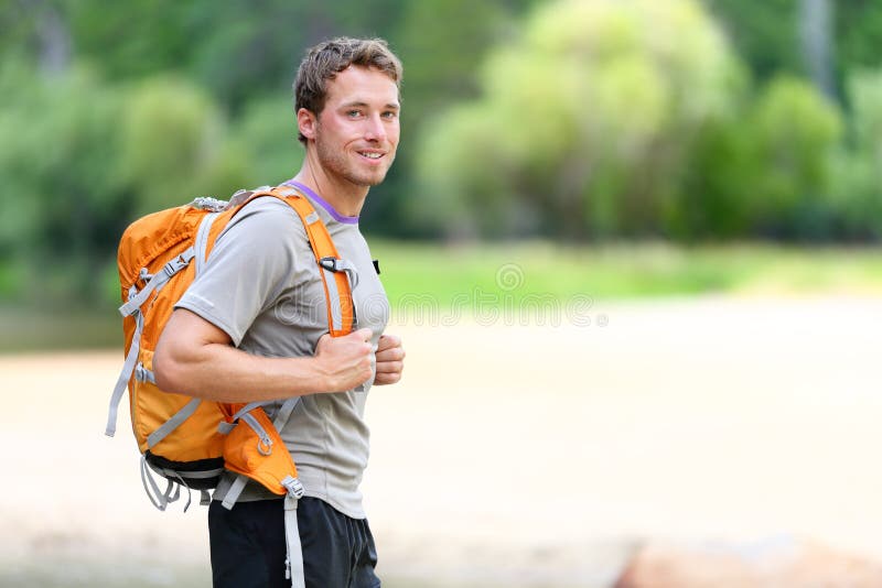 Hiking man portrait with backpack in nature