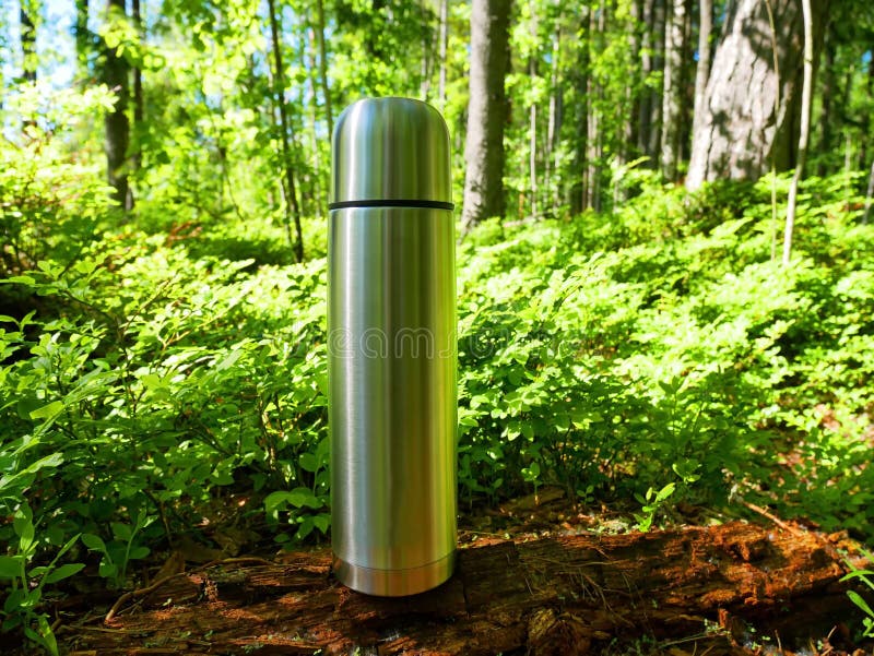 Hiking with a Thermos in Nature. Metal Thermos for Tea and Drinks