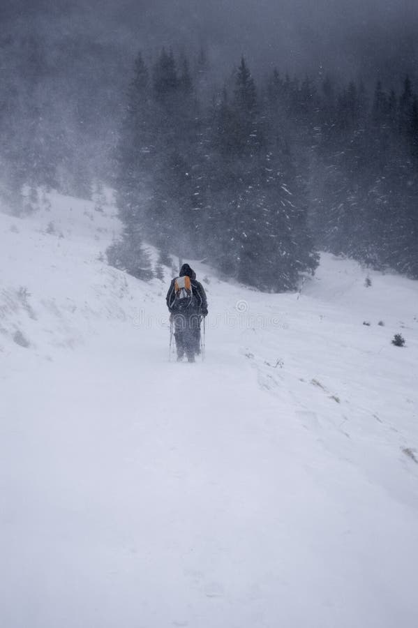 Hiking to top of a mountain in winter.