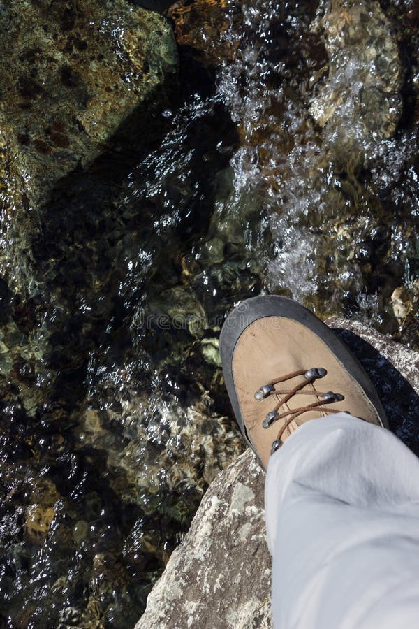 Closeup of very used trekking boots. Concept of high reliability and safety. Closeup of very used trekking boots. Concept of high reliability and safety