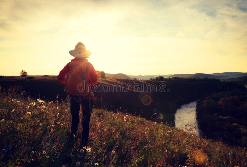 Woman enjoy the view in the autumn forest