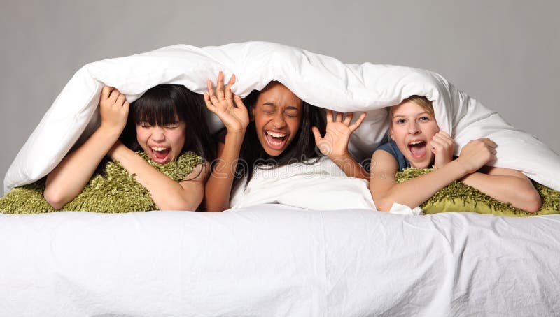 Pyjama Party Fun for Teenage Girls in Bed at Home Stock Image - Image of  black, hair: 21470119