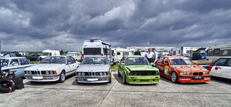 Hildesheim, Germany, May 21, 2022: Line up classic BMW touring race cars in the paddock for a racing event with classic automobiles