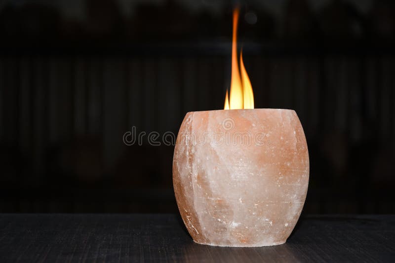 Himalayan salt lamp candle holder with black background. Natural salt lamps are famous all over the world for their unique beautiful light. These salt lamps emit colorful apricot, yellow & orange light. These are carefully crafted from rock salt taken from mines in Salt Range Mountain located near Quaidabad, Khushab, Pakistan. Natural salt lamps are used to decorate drawing rooms, offices & bedrooms. It ionizes and purifies the air which can be very healthful for patients with asthma, joint pains & allergies. Today, the health benefits of ionizers are well recognized; whilst most ionizers in the market are manmade, the crystal salt lamps are Mother Nature`s beautiful alternative to cleanse & deodorize air. Himalayan salt lamp candle holder with black background. Natural salt lamps are famous all over the world for their unique beautiful light. These salt lamps emit colorful apricot, yellow & orange light. These are carefully crafted from rock salt taken from mines in Salt Range Mountain located near Quaidabad, Khushab, Pakistan. Natural salt lamps are used to decorate drawing rooms, offices & bedrooms. It ionizes and purifies the air which can be very healthful for patients with asthma, joint pains & allergies. Today, the health benefits of ionizers are well recognized; whilst most ionizers in the market are manmade, the crystal salt lamps are Mother Nature`s beautiful alternative to cleanse & deodorize air.