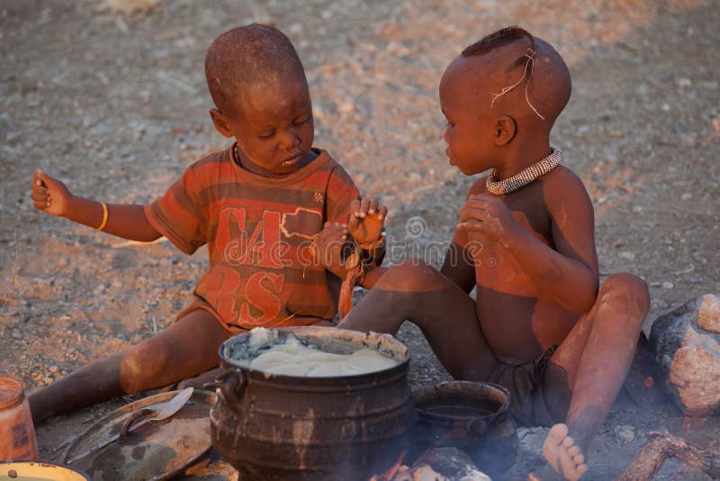 Himba children eating royalty free stock images