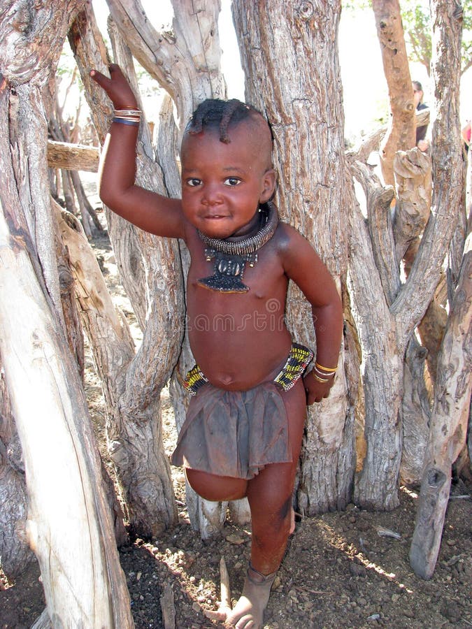 Africa, Namibia: The Himba wear little clothing, but the women are famous for covering themselves with a mixture of butter fat and ochre, possibly to protect themselves from the sun.The mixture gives their skins a reddish tinge. This symbolizes earth's rich red color and the blood that symbolizes life, and is consistent with the Himba ideal of beauty. Africa, Namibia: The Himba wear little clothing, but the women are famous for covering themselves with a mixture of butter fat and ochre, possibly to protect themselves from the sun.The mixture gives their skins a reddish tinge. This symbolizes earth's rich red color and the blood that symbolizes life, and is consistent with the Himba ideal of beauty.