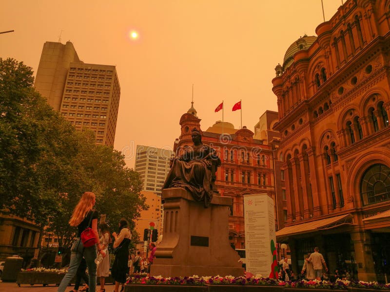 The sky and the sun, in front of QVB queen Victory Building city CBD, was covered by red smoke from bush fire, Australia 6-12-2019. The sky and the sun, in front of QVB queen Victory Building city CBD, was covered by red smoke from bush fire, Australia 6-12-2019