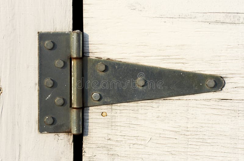 A close up picture of hinge on door