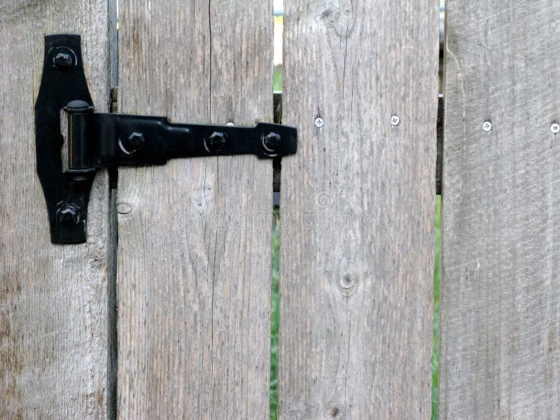 Wood garden gate with black hinge. Wood garden gate with black hinge.