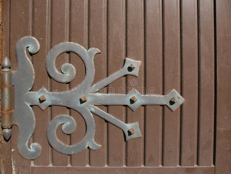 Hinge on wooden door. Backgrounds