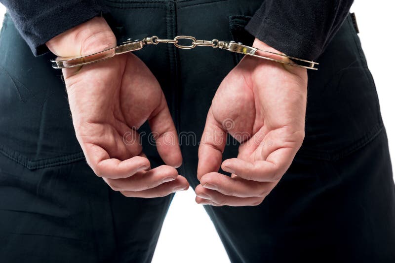 Hinter der Hand in der Handschellennahaufnahme lizenzfreies stockfoto Hinter der Hand in der Handschellennahaufnahme lizenzfreies stockfoto