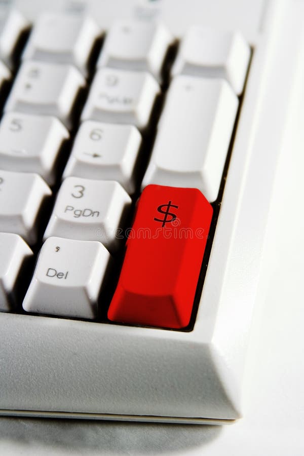 Desktop computer keyboard number pad with dollar sign on a red enter key. Desktop computer keyboard number pad with dollar sign on a red enter key.