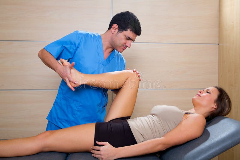 Hip mobilization therapy by therapist to beautiful woman royalty free stock photo Hip mobilization therapy by therapist to beautiful woman royalty free stock photo