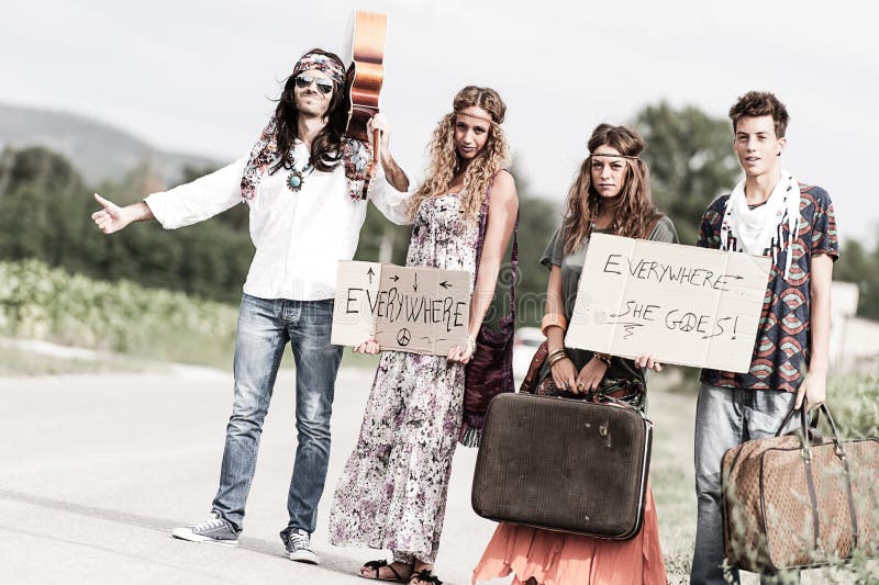 Hippie Group Hitchhiking on a Countryside Road Stock Image - Image of ...