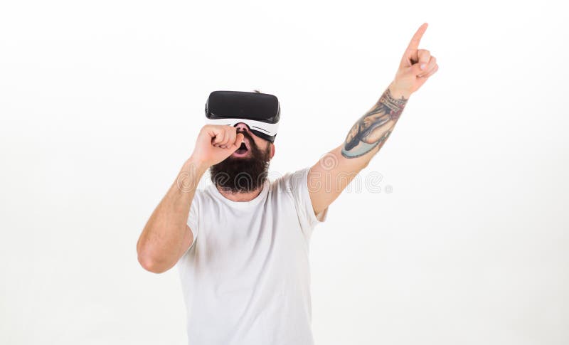 Hipster on busy face use modern technologies for entertainment or education. Man with beard in VR glasses, white stock images Hipster on busy face use modern technologies for entertainment or education. Man with beard in VR glasses, white stock images