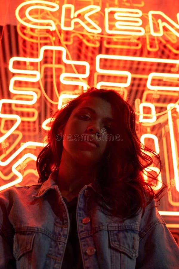 Hipster Cool African Gen Z Lady Looking at Camera Under Red Neon Night ...