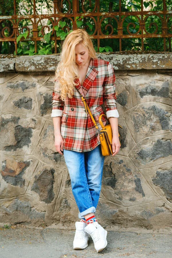 Hipster Girl with Long Blonde Hair Wearing Trendy Plaid Jacket