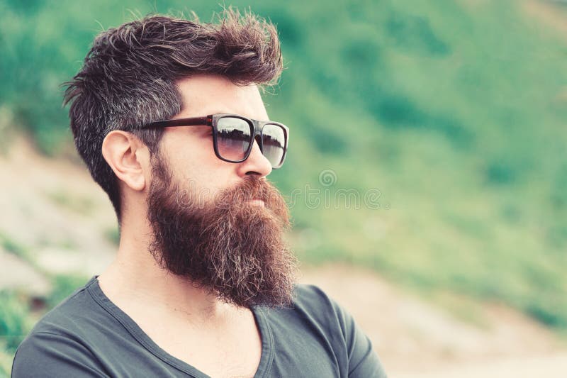 Hipster Man in Trendy Sunglasses Standing on Slope with Lush Green Glass in  Spring. Bearded Man with Stylish Hairstyle Stock Image - Image of enjoy,  city: 130972241