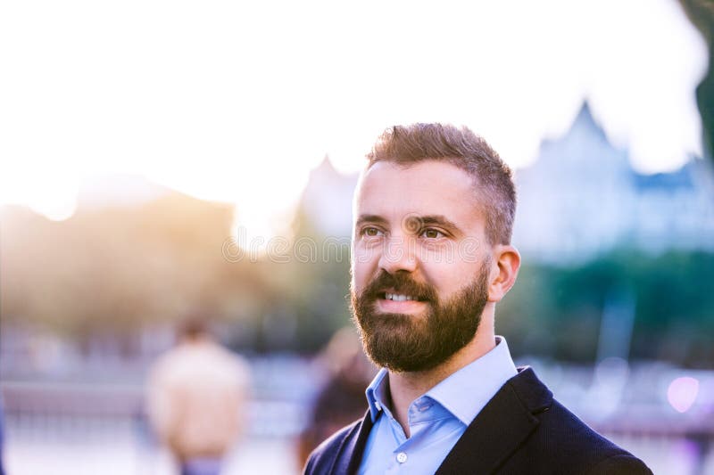 Hipster manager in blue shirt walking in the street royalty free stock photos Hipster manager in blue shirt walking in the street royalty free stock photos