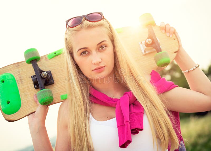 Hipster Teenage Girl with Skateboard, Image with Sunflare Stock Photo ...