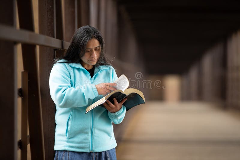 Hispanic Woman Reading Bible On Bridge Stock Image Image Of Education Hispanic 142902181