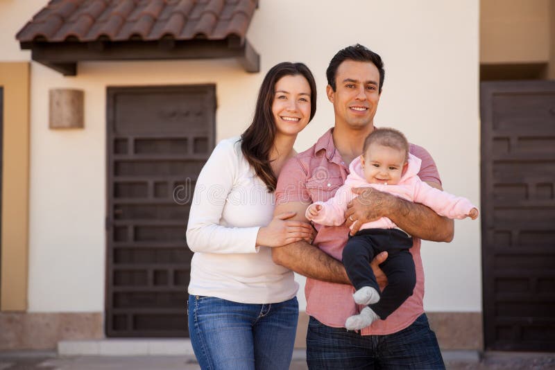 Hispanic couple and baby in their new home royalty free stock image Hispanic couple and baby in their new home royalty free stock image
