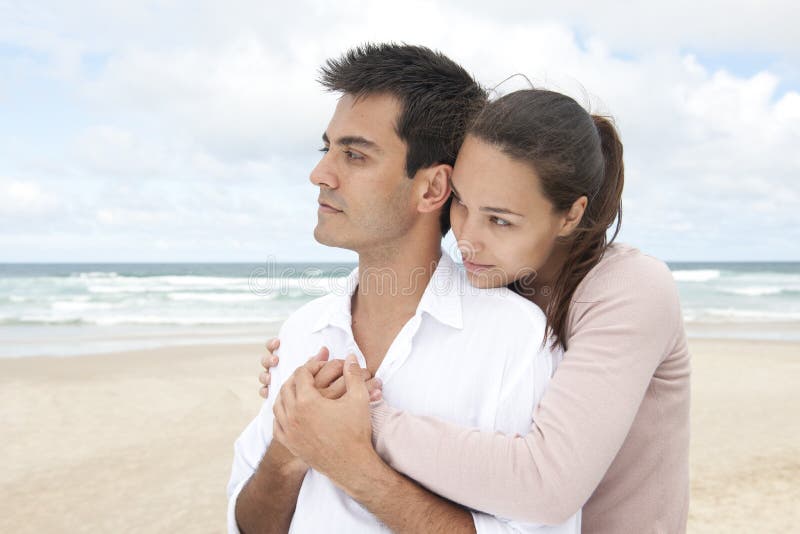 Hispanic couple bonding on beach