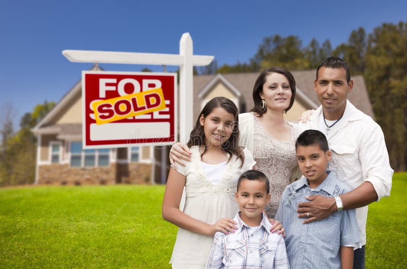 Hispanic Family, New Home and Sold Real Estate Sign stock images Hispanic Family, New Home and Sold Real Estate Sign stock images