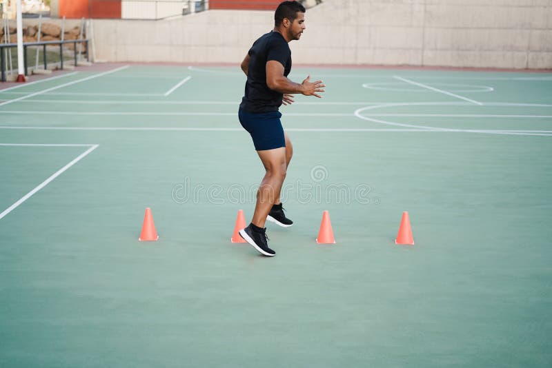 Hispanic Man Doing Speed and Agility Cone Drills Workout Session