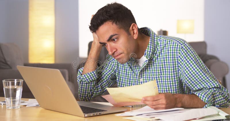 Hispanic man frustrated with his bills royalty free stock photos Hispanic man frustrated with his bills royalty free stock photos