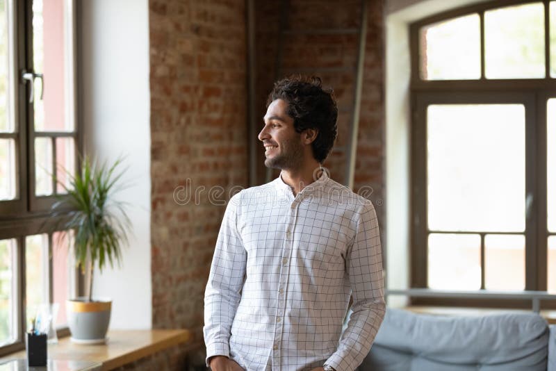 Premium Photo  Unrecognizable young man stands by the window