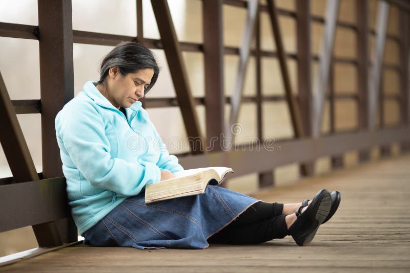 hispanic woman reading bible