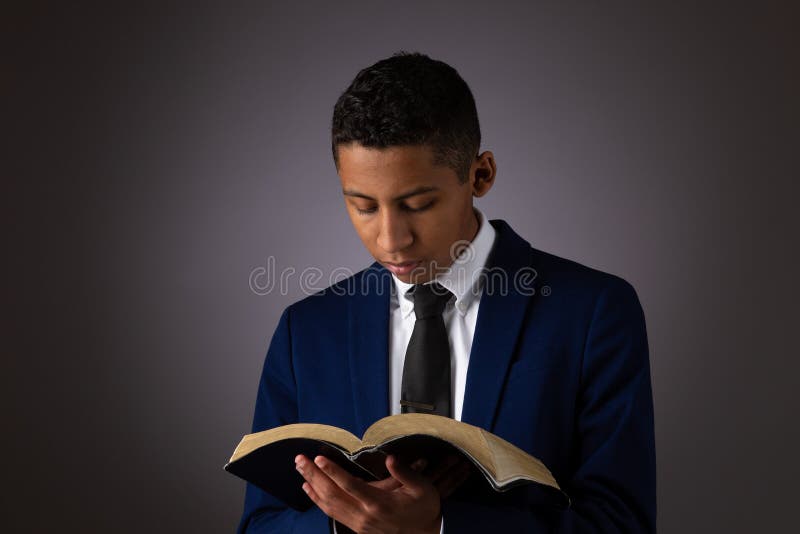 Hispanic Young Teenager Boy Searching the Scriptures, The Word of God, The Bible