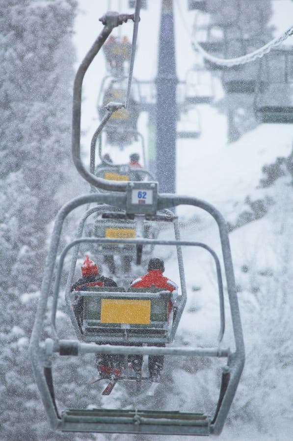 Gondolas over ski slopes in Chimbulak, Kazakhstan. Strong snowfall. Gondolas over ski slopes in Chimbulak, Kazakhstan. Strong snowfall.