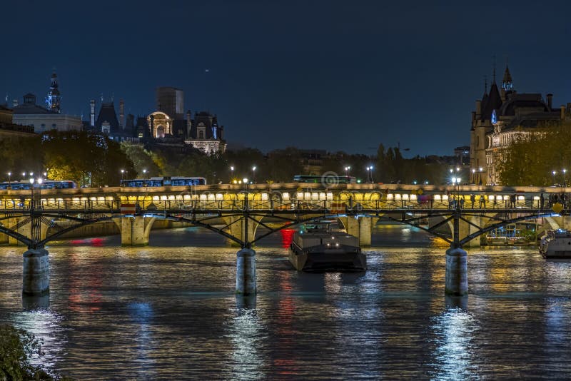 Historic Bridges in Paris at Night with Boats Traffic on Seine River ...