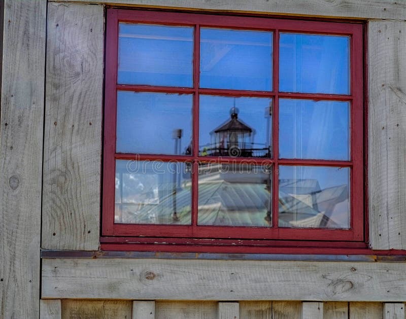 Historic Hooper Strait Lighthouse reflected in Window