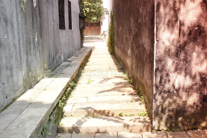A historic lane with mottled wall extending a mystery yard. A historic lane with mottled wall extending mystery yard stock photos A historic lane with mottled wall extending a mystery yard. A historic lane with mottled wall extending mystery yard stock photos