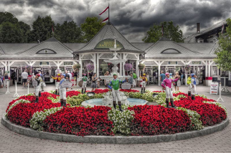 The entrance to historic Saratoga Racecourse with its iconic fountain with the 12 stakes winning jockey statues.